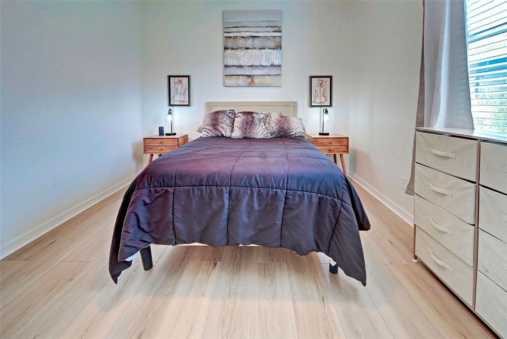 12086 Granite Woods Loop Venice, FL 34292 - Photo 40 of 85 a bedroom with a bed and a window