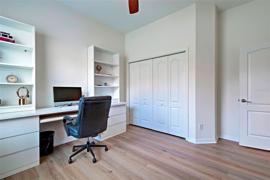 12086 Granite Woods Loop Venice, FL 34292 - Photo 44 of 85 a view of a workspace with furniture and wooden floor