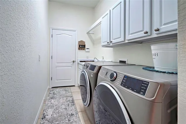 a kitchen with a sink stove and refrigerator