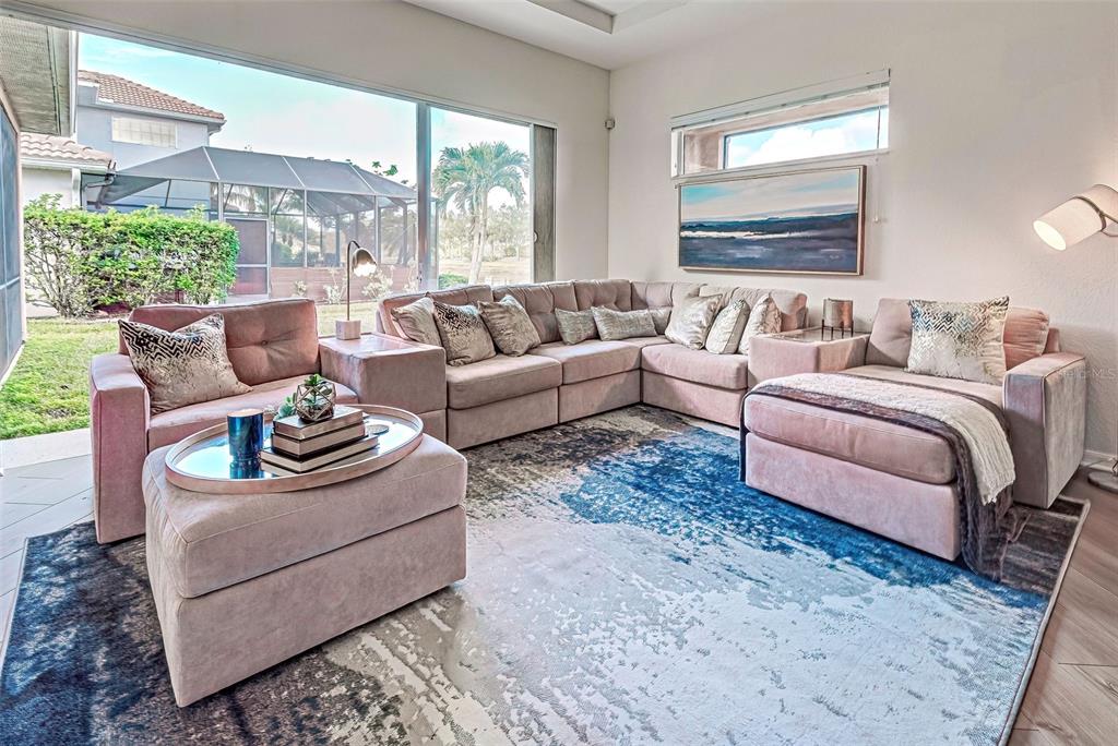 12086 Granite Woods Loop Venice, FL 34292 - Photo 6 of 85 a living room with furniture and a large window