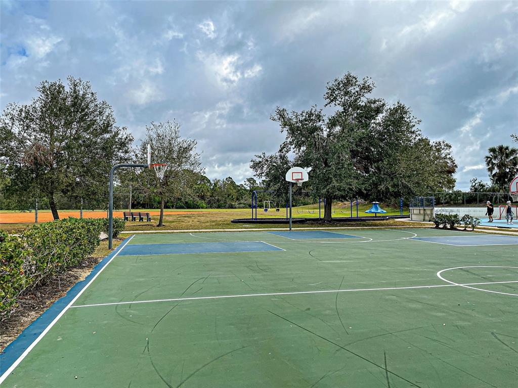 12086 Granite Woods Loop Venice, FL 34292 - Photo 81 of 85 a view of a tennis court