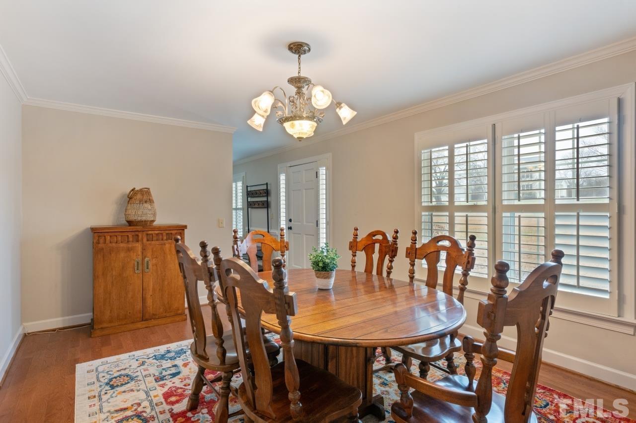 1604 Habbot Drive Raleigh, NC 27603 - Photo 12 of 35 a view of a dining room with furniture and chandelier