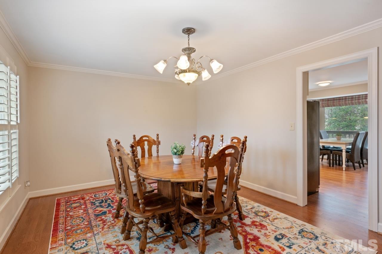1604 Habbot Drive Raleigh, NC 27603 - Photo 13 of 35 a view of a dining room with furniture and wooden floor