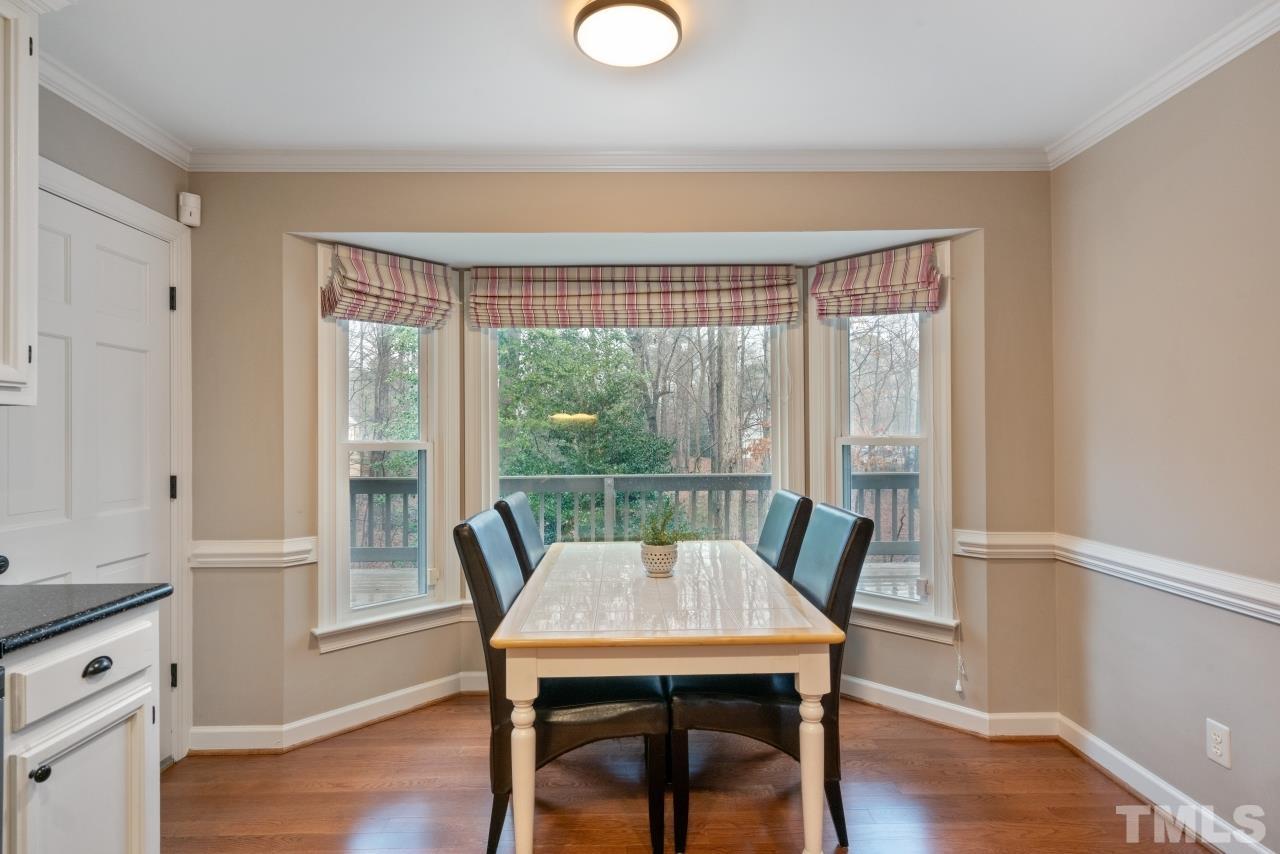 1604 Habbot Drive Raleigh, NC 27603 - Photo 14 of 35 a view of a dining room with furniture window and wooden floor
