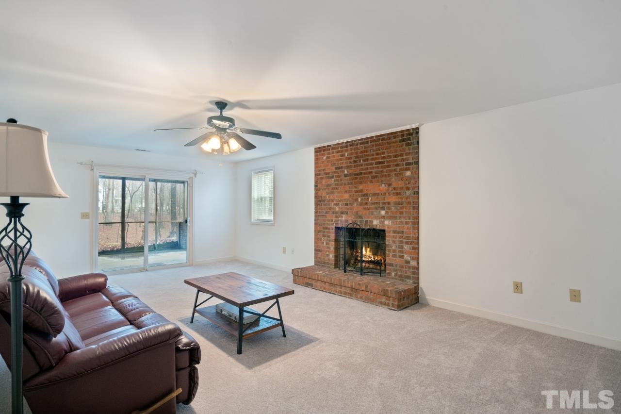 1604 Habbot Drive Raleigh, NC 27603 - Photo 16 of 35 a living room with furniture and a fireplace