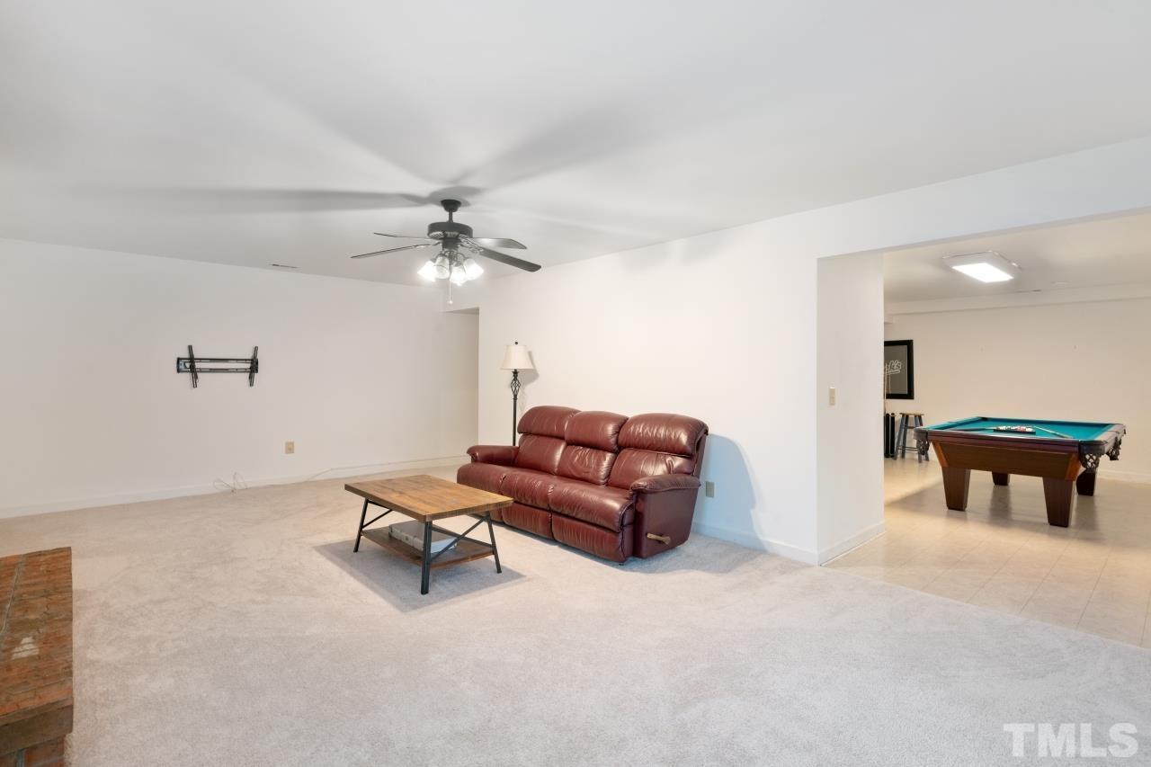 1604 Habbot Drive Raleigh, NC 27603 - Photo 18 of 35 a living room with furniture and a ceiling fan