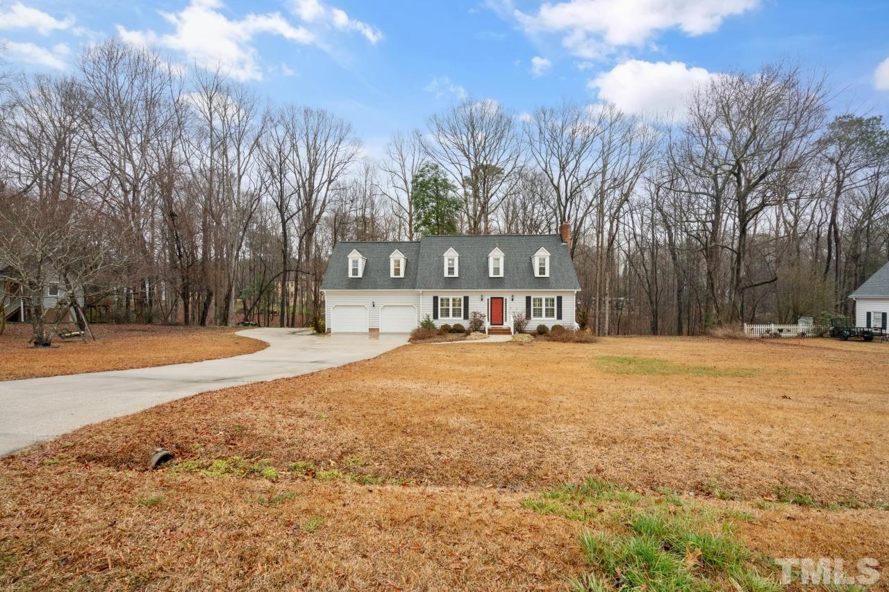 1604 Habbot Drive Raleigh, NC 27603 - Photo 2 of 35 a house with trees in front of it
