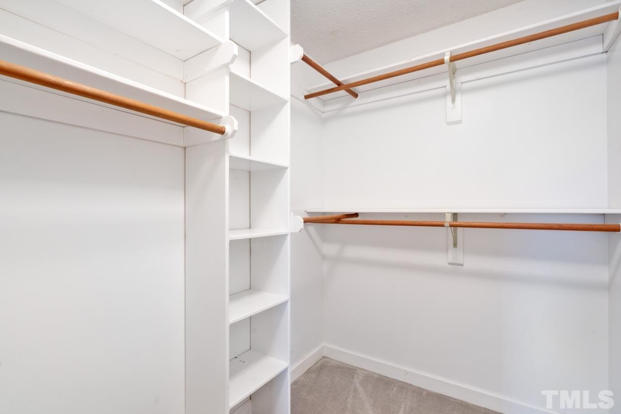 1604 Habbot Drive Raleigh, NC 27603 - Photo 24 of 35 a view of walk in closet with empty racks