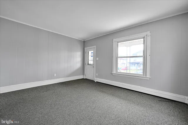 a view of an empty room and window