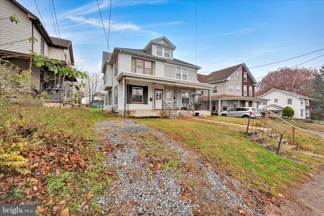 a front view of a building with garden