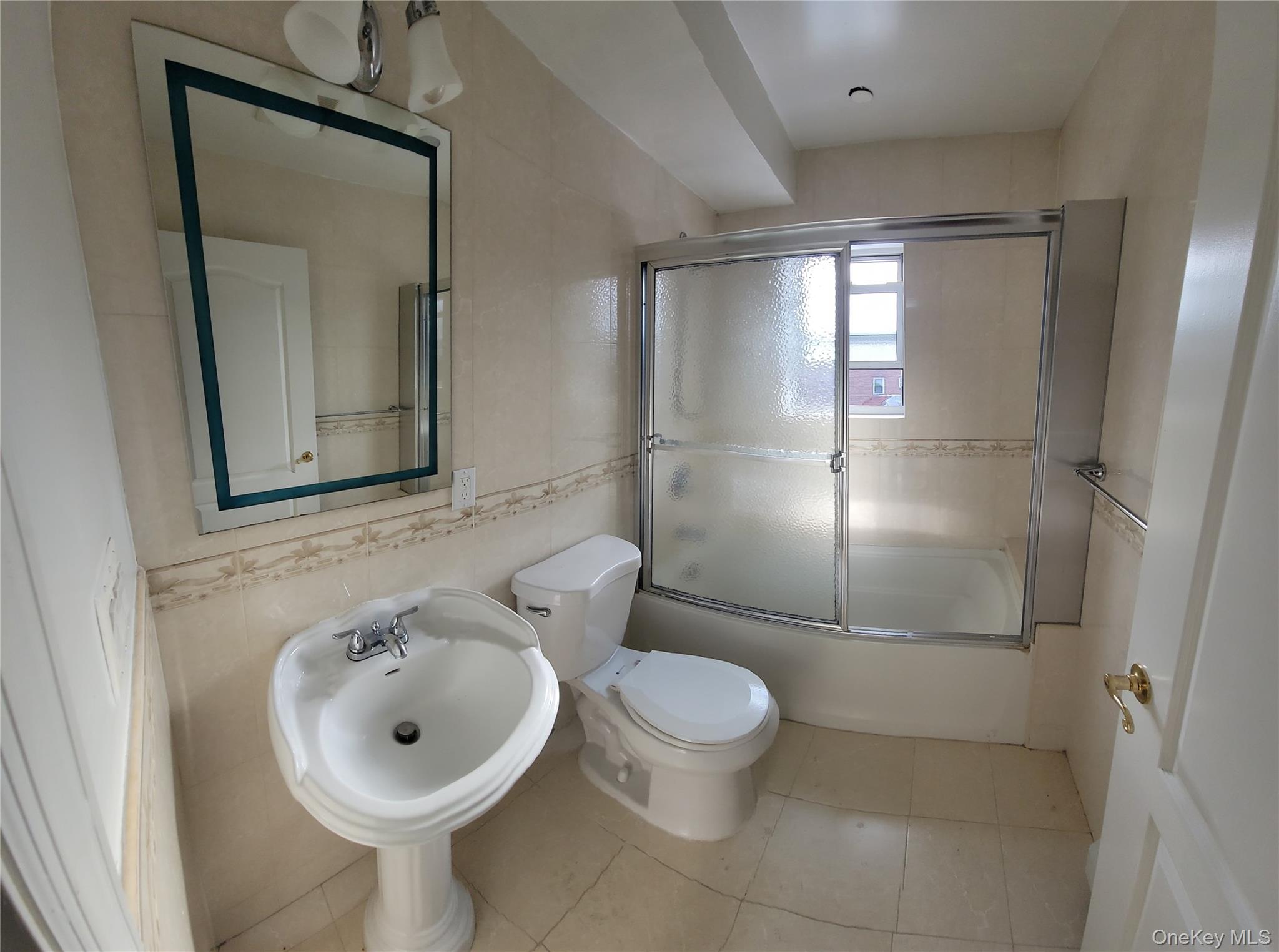 108-27 63rd Avenue, Unit 3B Queens, NY 11375 - Photo 17 of 17 a bathroom with a sink toilet and shower