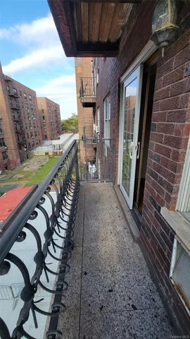 a view of a balcony with furniture