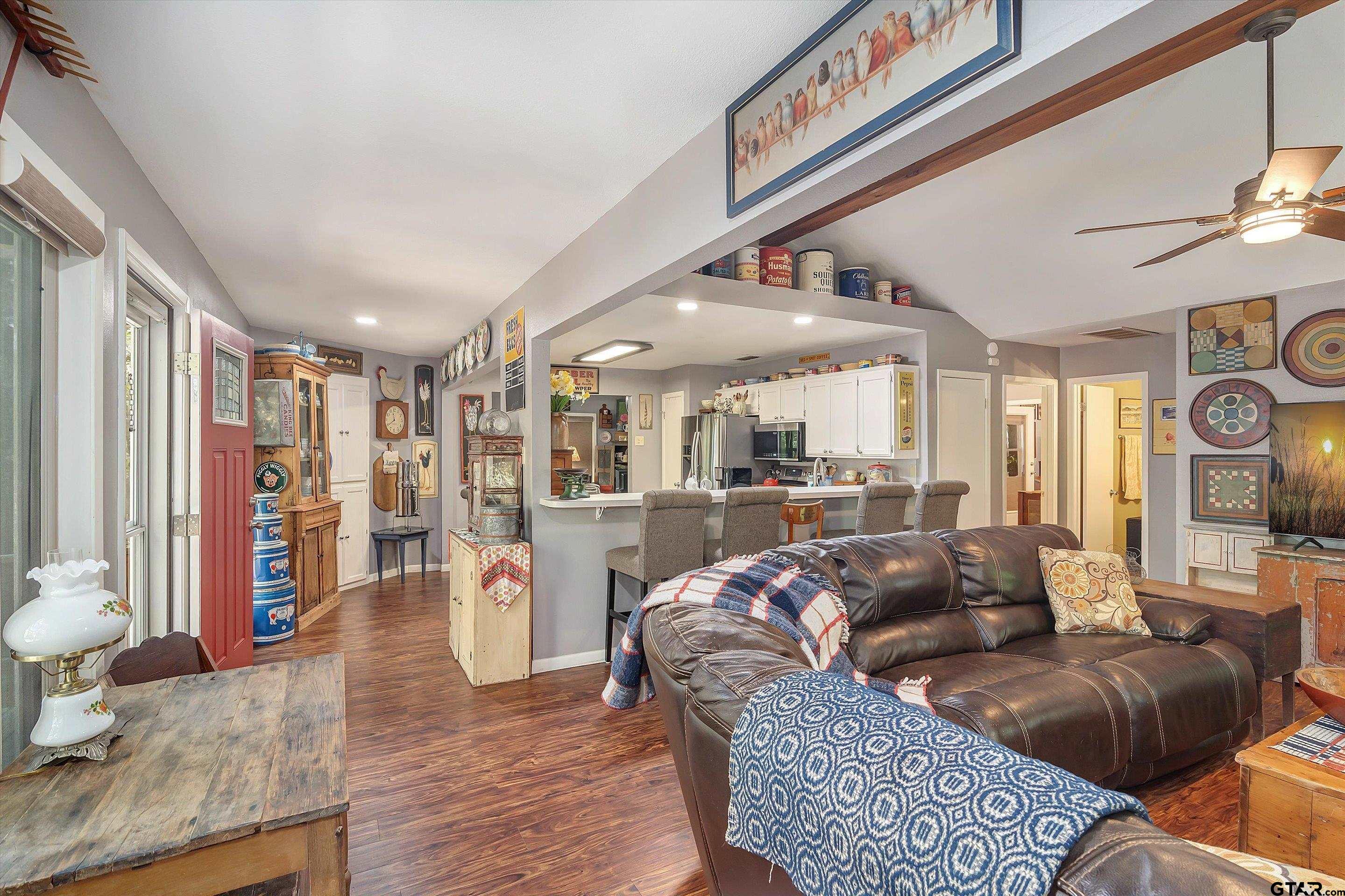 210 Magnolia Lane Holly Lake Ranch, TX 75765 - Photo 16 of 42 a living room with furniture and a large window