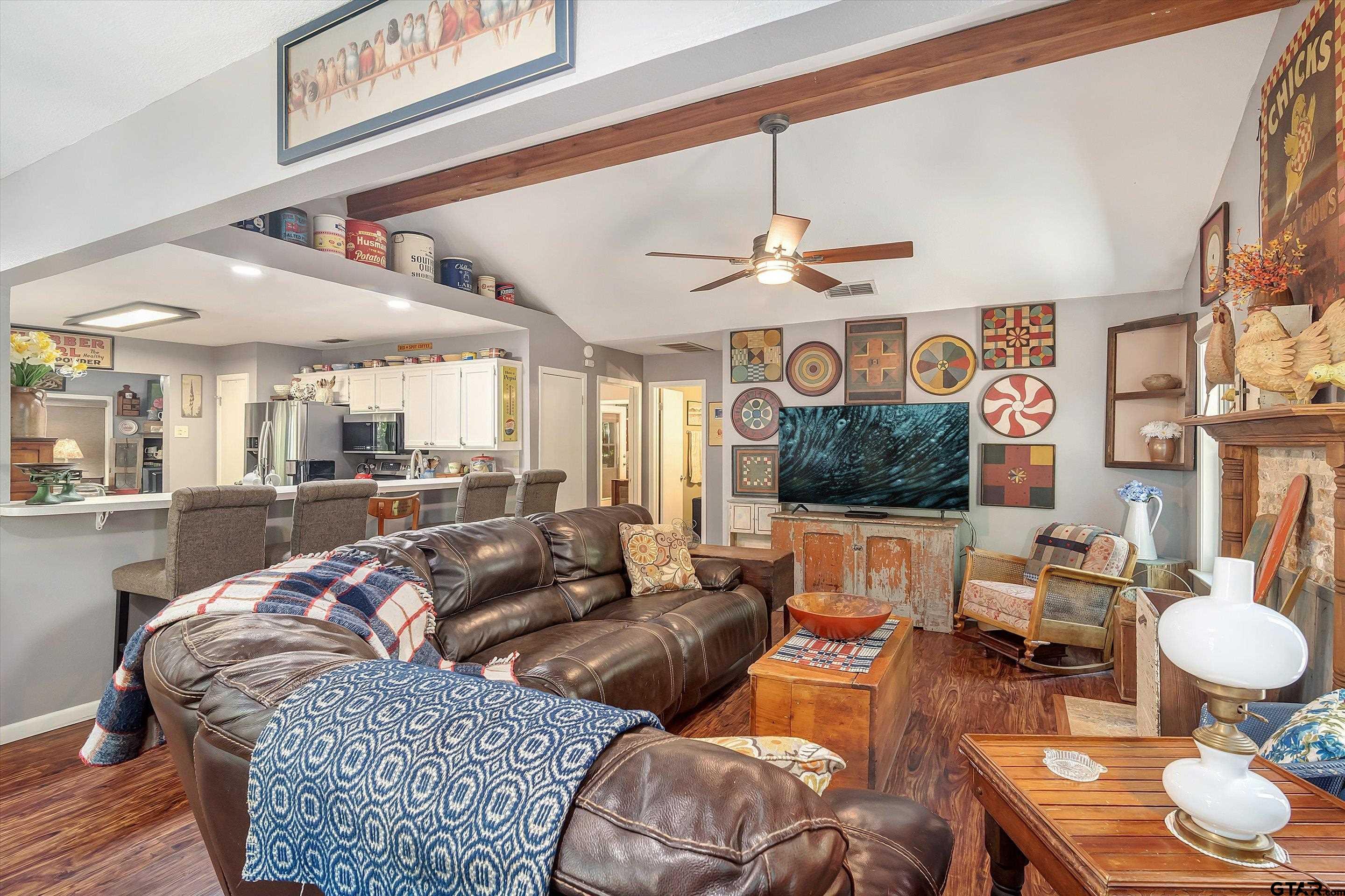 210 Magnolia Lane Holly Lake Ranch, TX 75765 - Photo 17 of 42 a living room with furniture and a flat screen tv