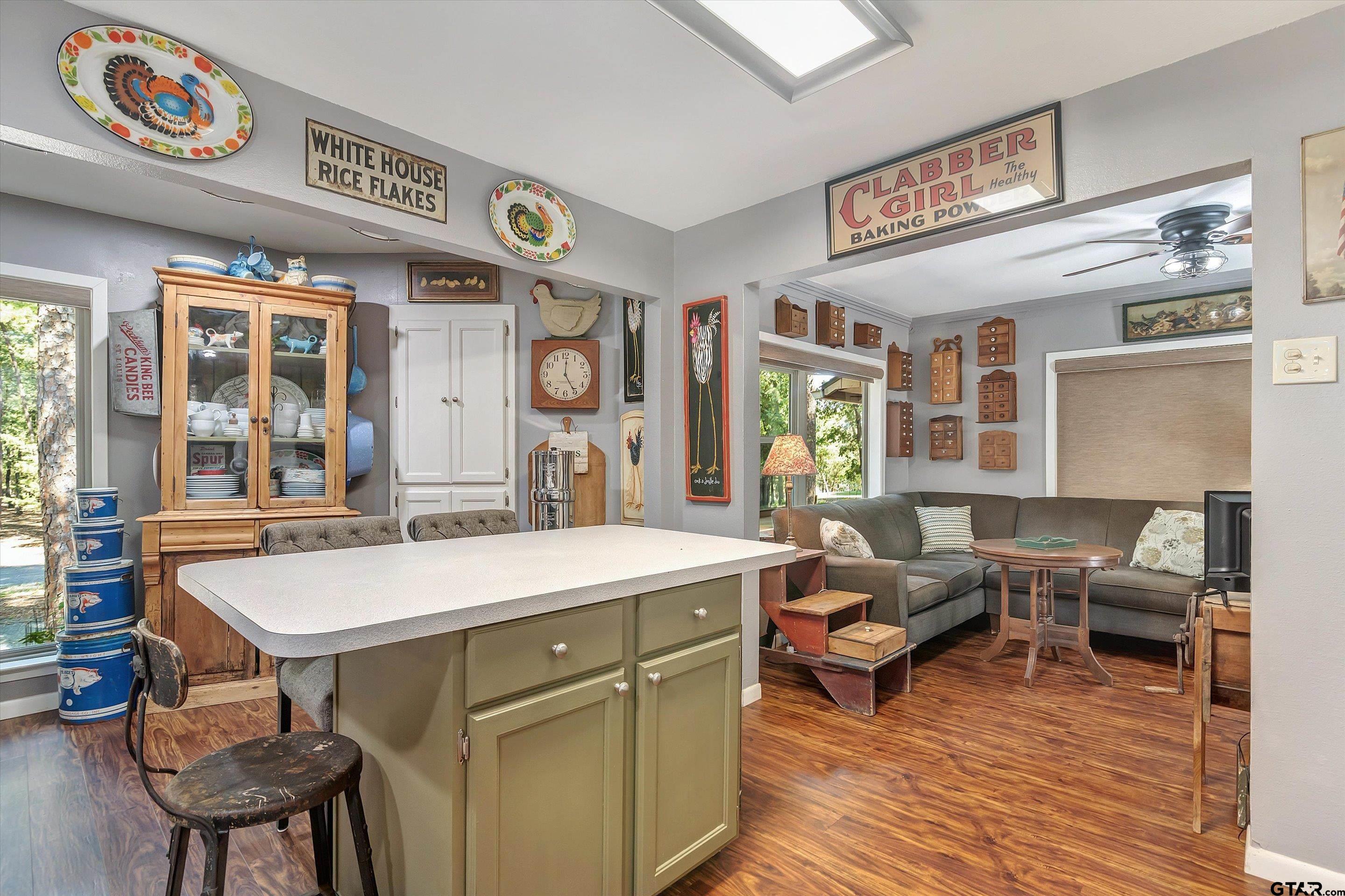 210 Magnolia Lane Holly Lake Ranch, TX 75765 - Photo 30 of 42 a view of a dining room with furniture window and wooden floor