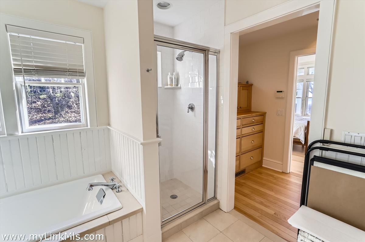 78 Hammett Road Chilmark, MA 02535 - Photo 24 of 53 a bathroom with a tub shower sink and mirror
