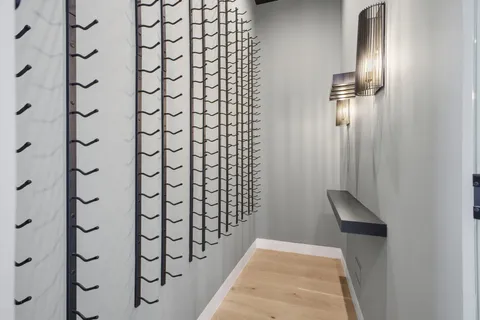 a kitchen with a sink a refrigerator and cabinets