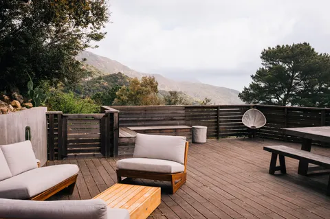 swimming pool view with a seating space