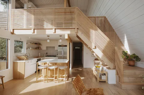 a view of a kitchen with furniture and windows