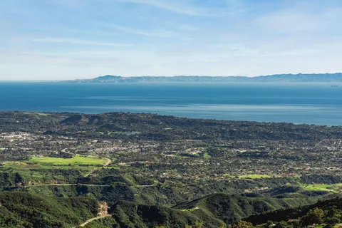 an aerial view of mountain with trees