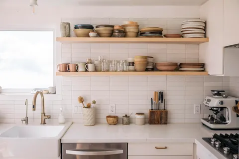a kitchen with a stove and cabinets