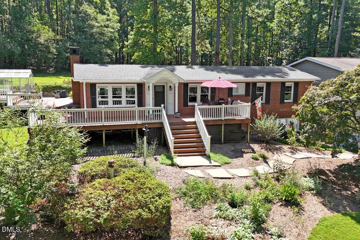 2129 Kelly Road Apex, NC 27502 - Photo 46 of 64 a front view of a house with a yard
