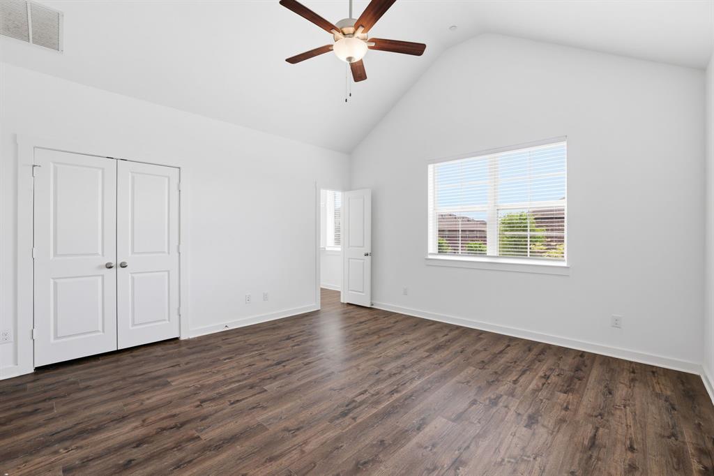 5832 Ridgeline Drive McKinney, TX 75070 - Photo 19 of 26 wooden floor in an empty room with a window