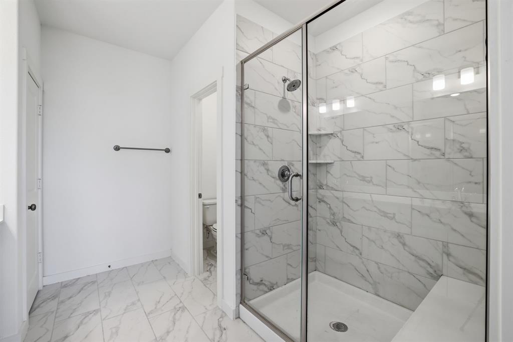 5832 Ridgeline Drive McKinney, TX 75070 - Photo 22 of 26 a bathroom with a shower