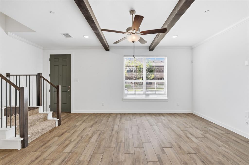 5832 Ridgeline Drive McKinney, TX 75070 - Photo 3 of 26 wooden floor in an empty room with a window