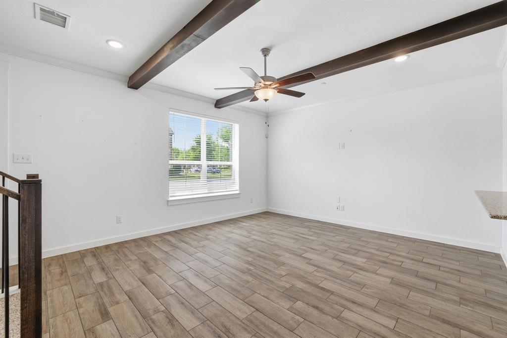 5832 Ridgeline Drive McKinney, TX 75070 - Photo 5 of 26 an empty room with wooden floor ceiling fan and windows