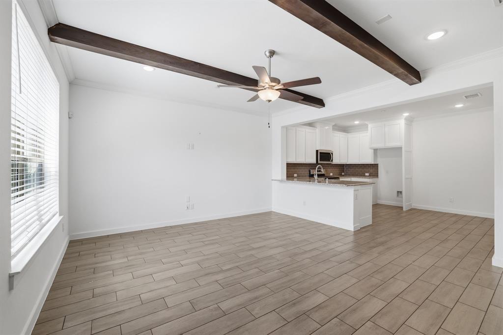 5832 Ridgeline Drive McKinney, TX 75070 - Photo 6 of 26 a view of kitchen with refrigerator and microwave