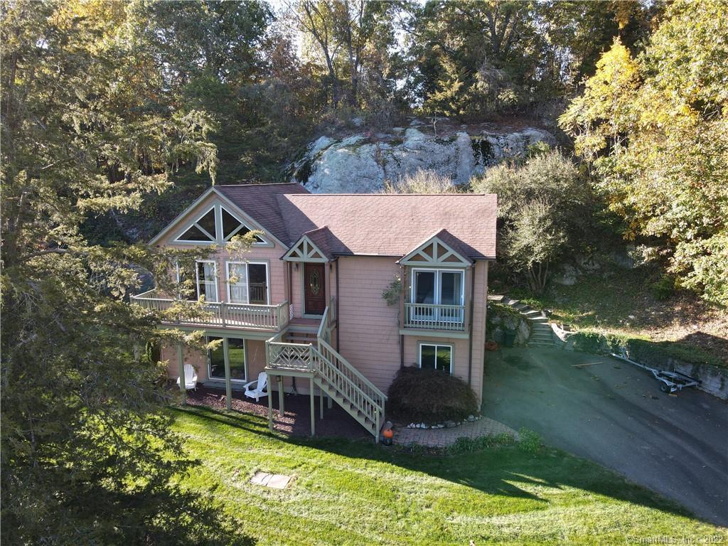 50 Buckingham Road Seymour, CT 06483 - Photo 1 of 1 a aerial view of a house with swimming pool next to a yard