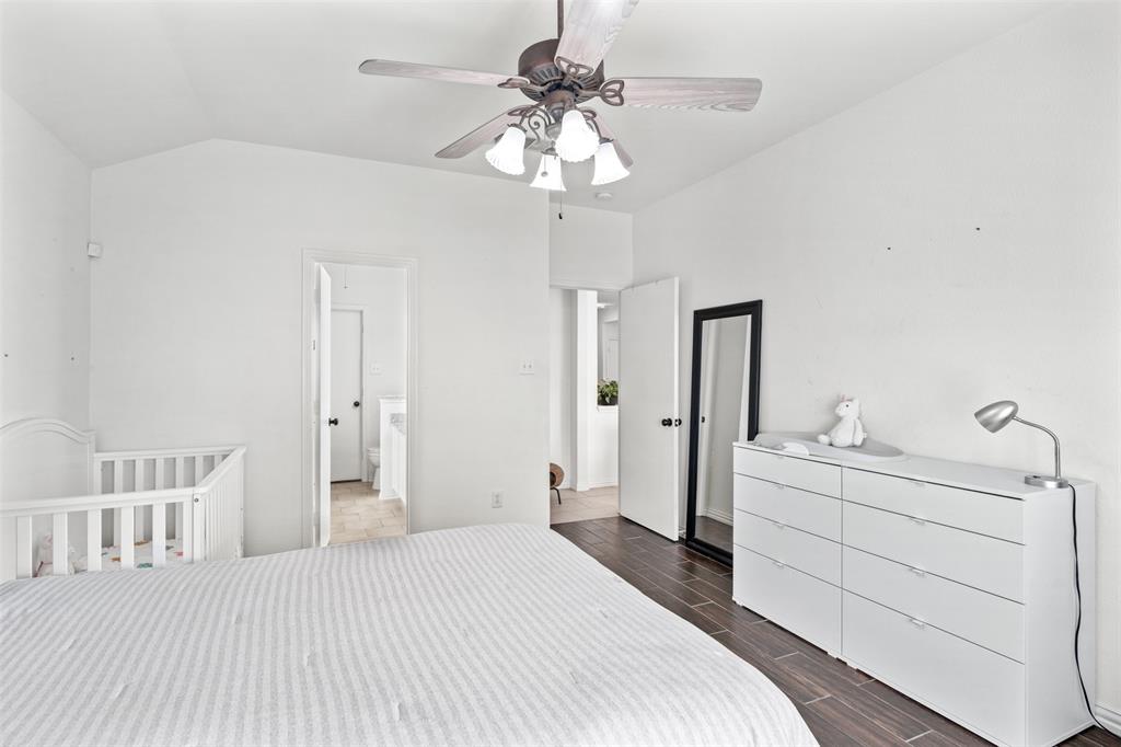 1011 Ridgecrest Drive McKinney, TX 75069 - Photo 20 of 31 Spacious room featuring a vaulted ceiling and dark wood-finish flooring