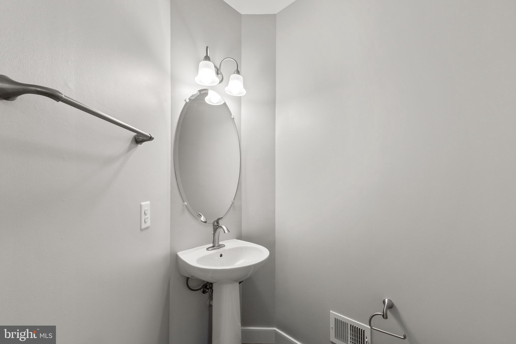 1815 Main Line Boulevard Alexandria, VA 22301 - Photo 26 of 47 Powder room at top of stairs off dining room