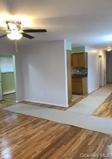 a view of a livingroom with wooden floor