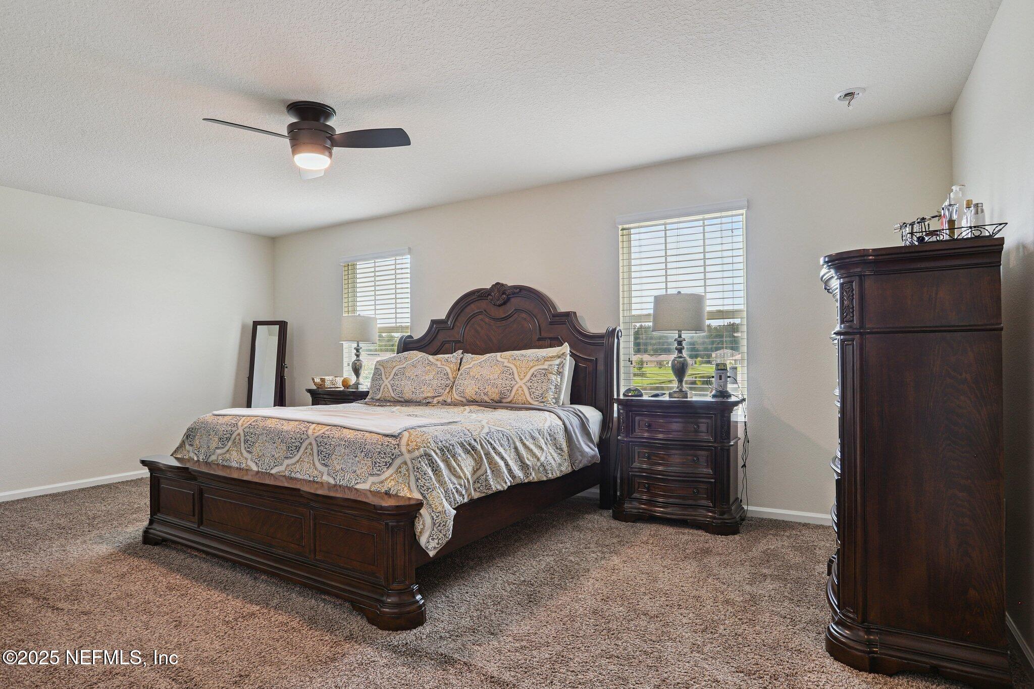 6829 Hanford Street Jacksonville, FL 32219 - Photo 14 of 24 a bedroom with a bed and a closet