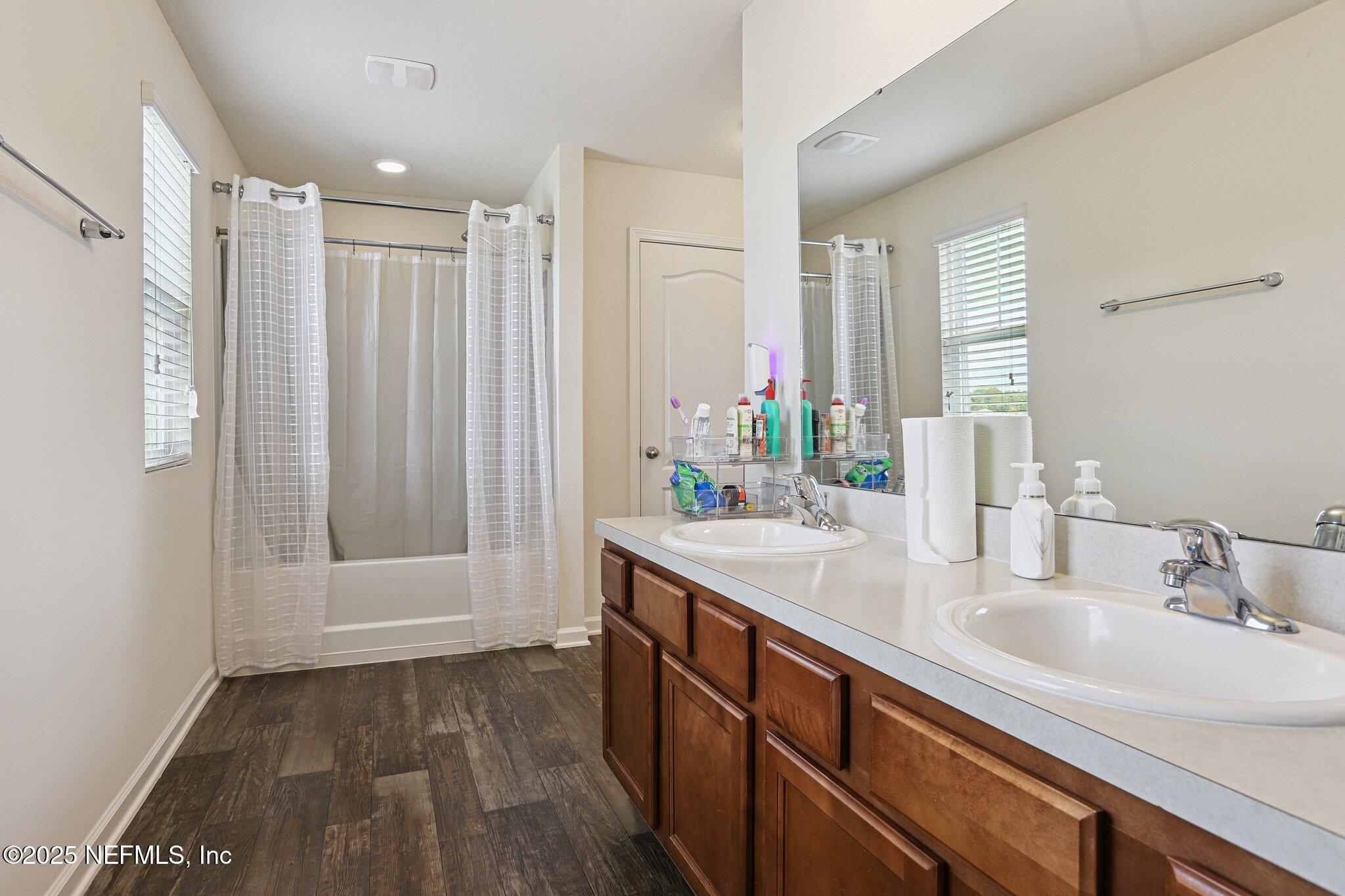 6829 Hanford Street Jacksonville, FL 32219 - Photo 16 of 24 a bathroom with a sink and a mirror