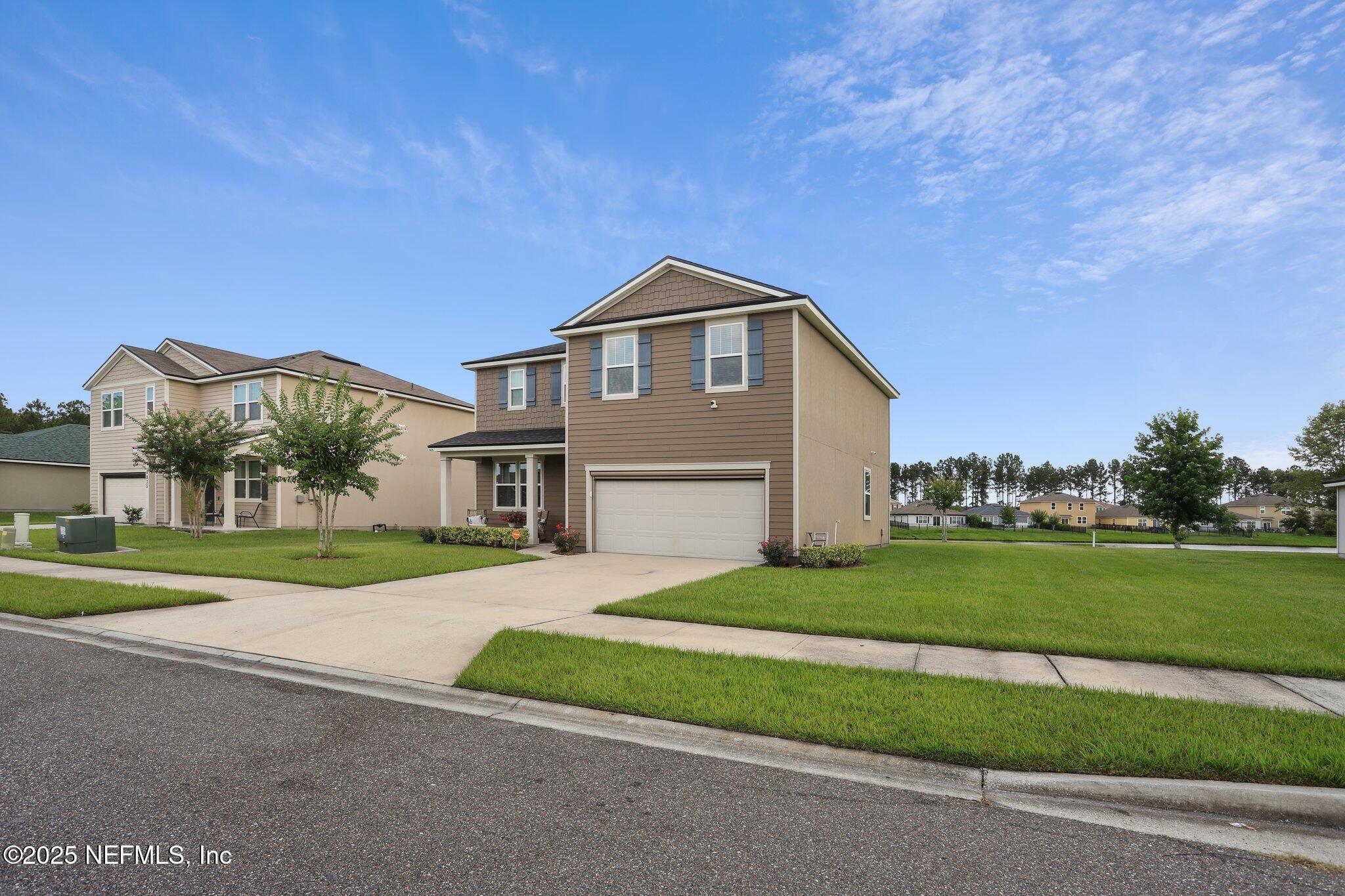 6829 Hanford Street Jacksonville, FL 32219 - Photo 2 of 24 a front view of a house with a yard