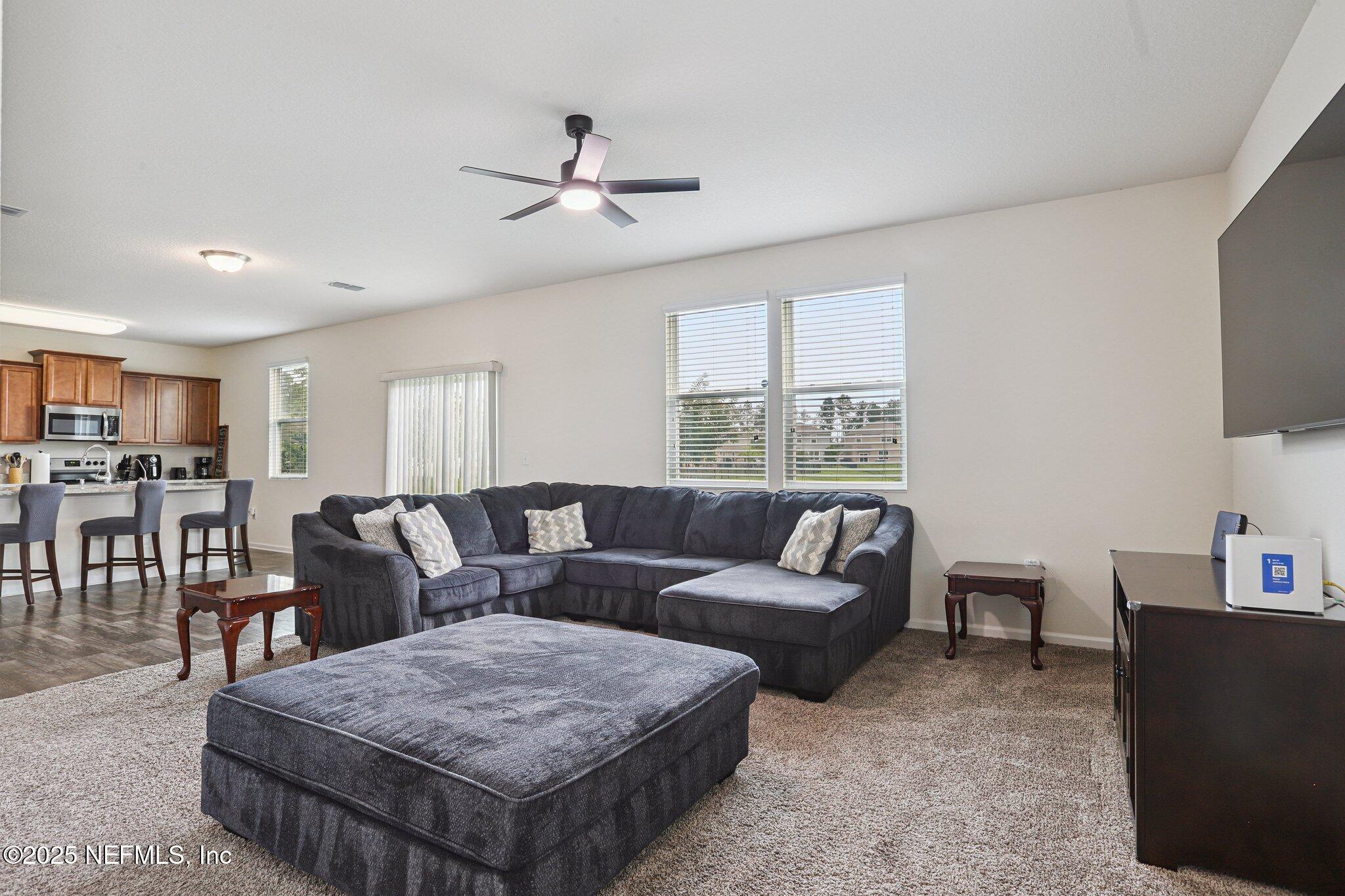 6829 Hanford Street Jacksonville, FL 32219 - Photo 8 of 24 a living room with furniture and a large window