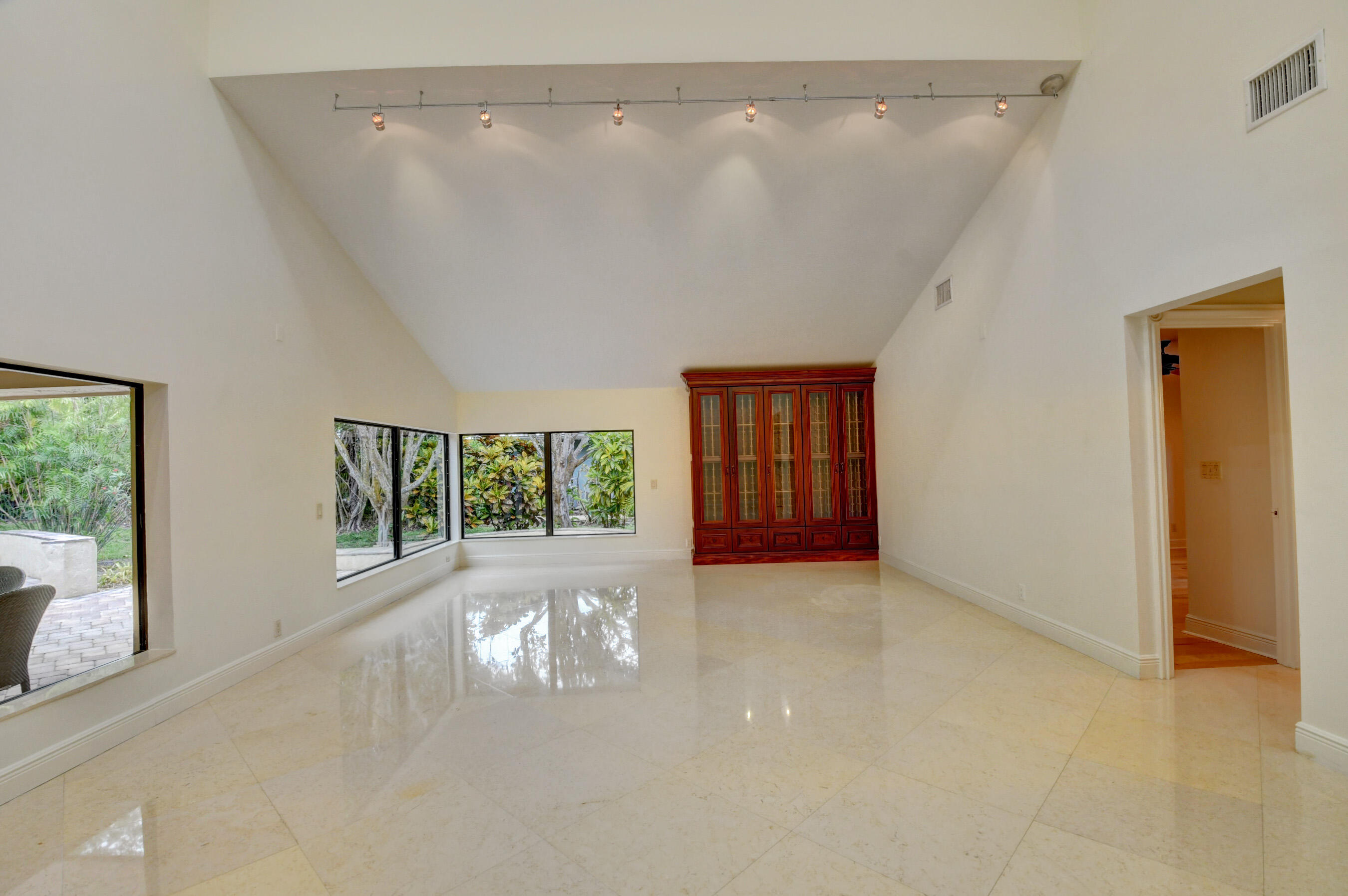 4535 Cocoplum Way Delray Beach, FL 33445 - Photo 12 of 50 Living with built in wine cabinet