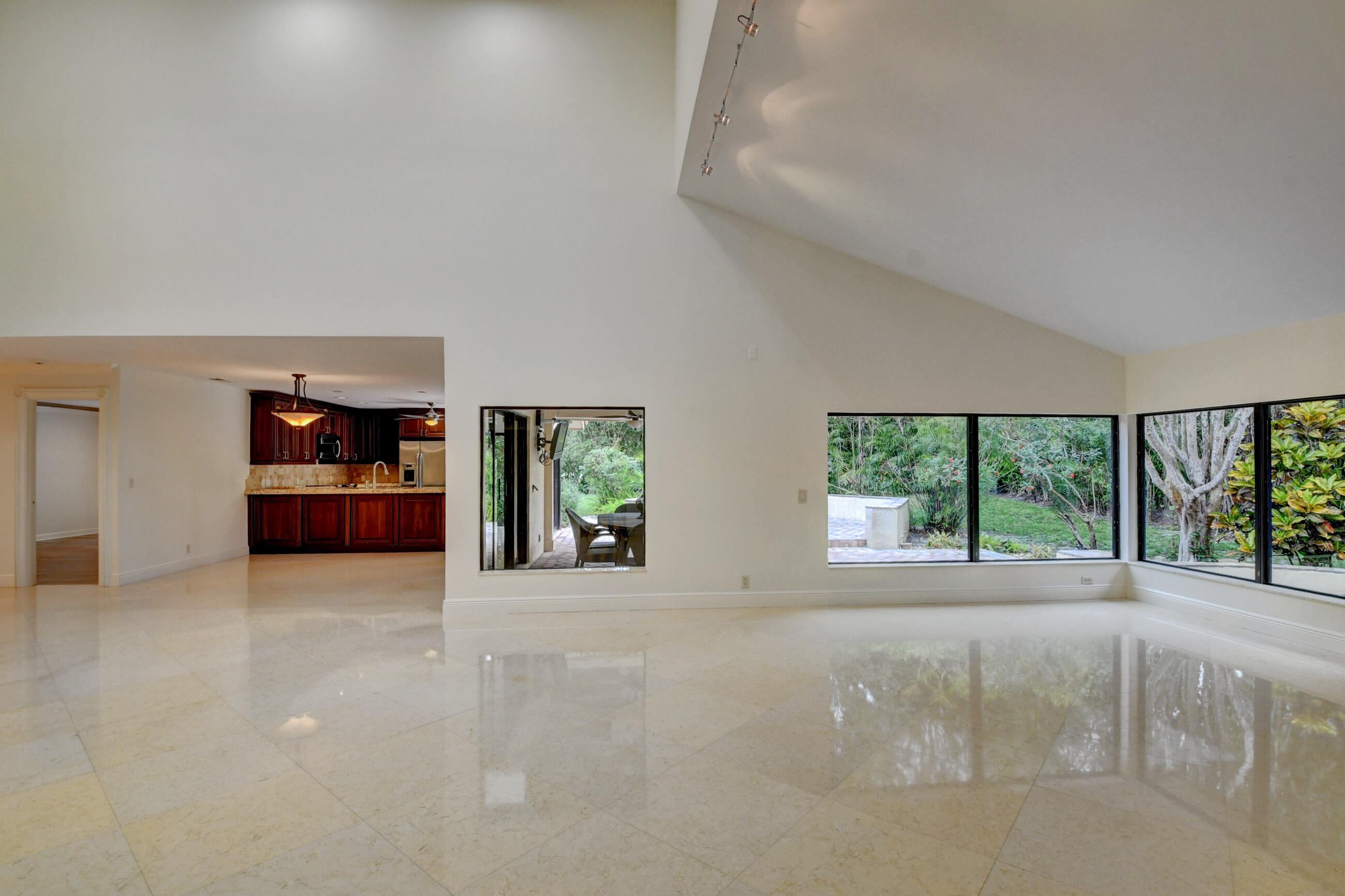 4535 Cocoplum Way Delray Beach, FL 33445 - Photo 16 of 50 Living adjacent to outdoor patio