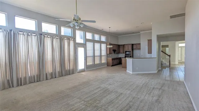 a view of a kitchen with furniture and a window