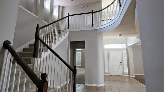a view of staircase with lots of white walls