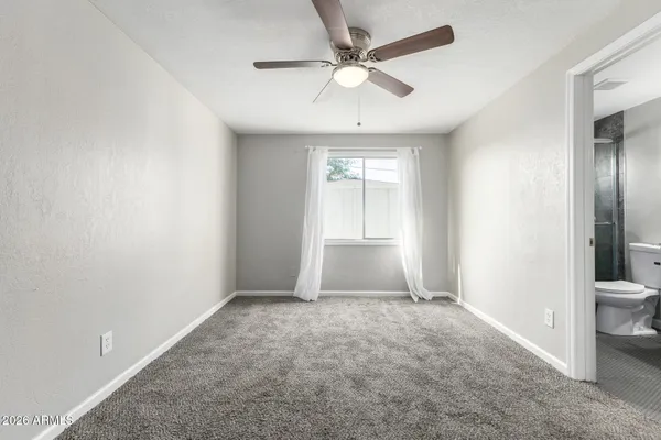 an empty room with a bathroom