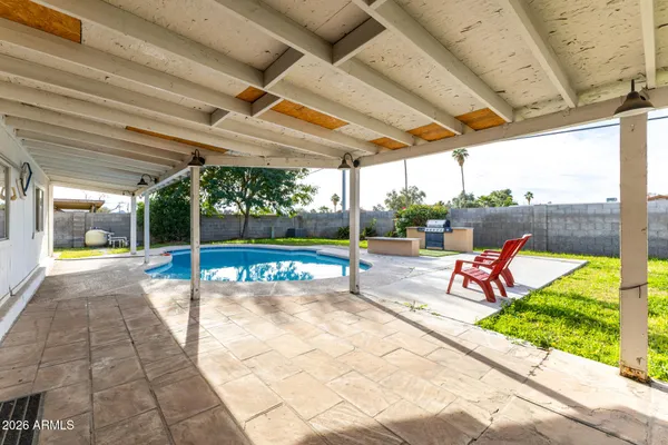 a view of a swimming pool with a porch