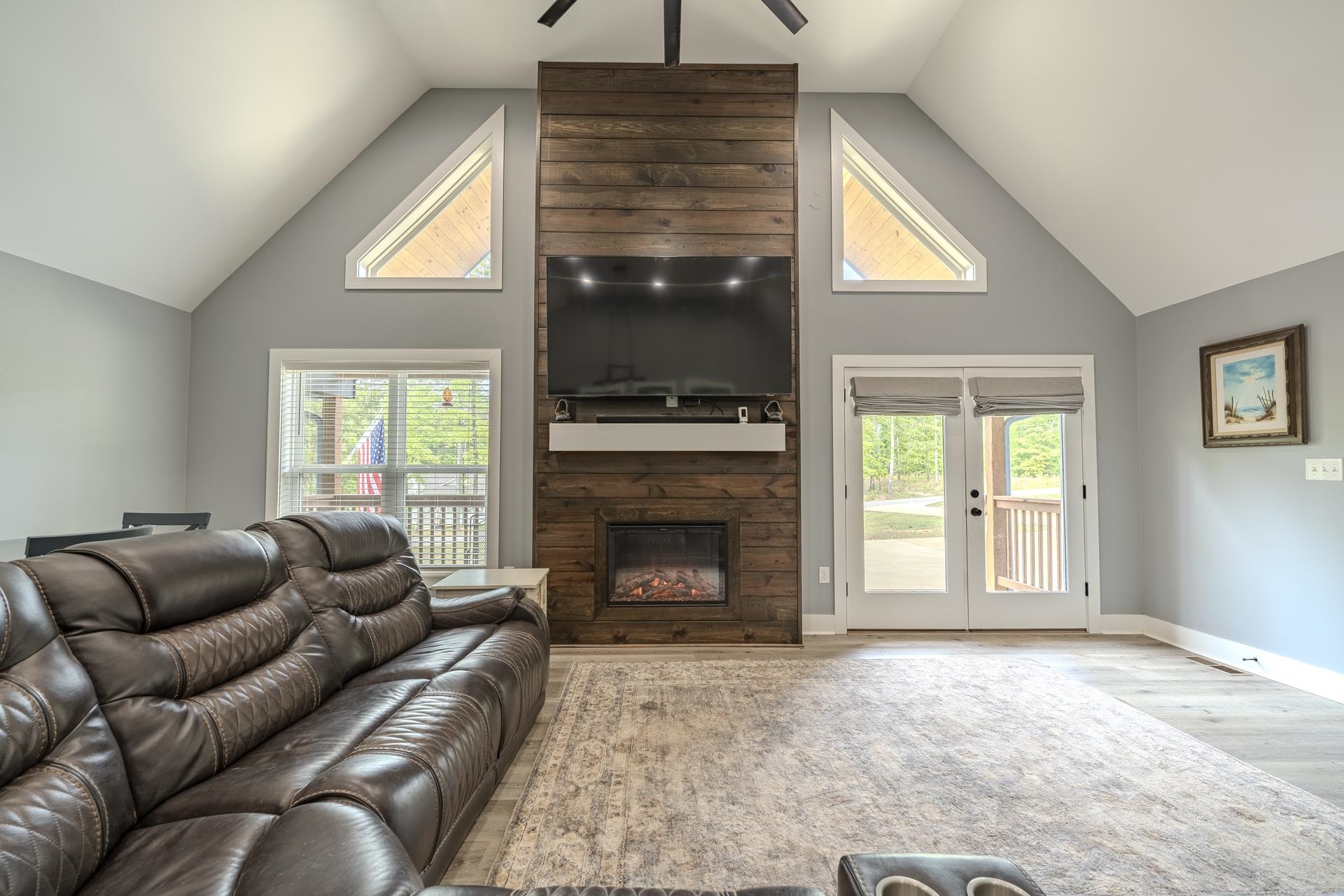 315 Timber Ridge Drive Counce, TN 38326 - Photo 7 of 40 a living room with furniture a window and a fireplace