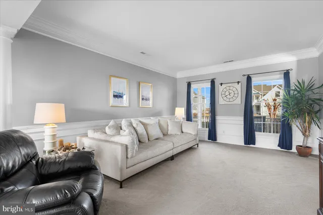 a living room with furniture rug and window