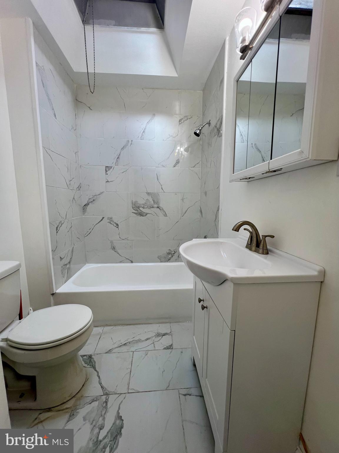 2610 Sylmar Street Philadelphia, PA 19142 - Photo 11 of 19 a bathroom with a sink toilet and shower