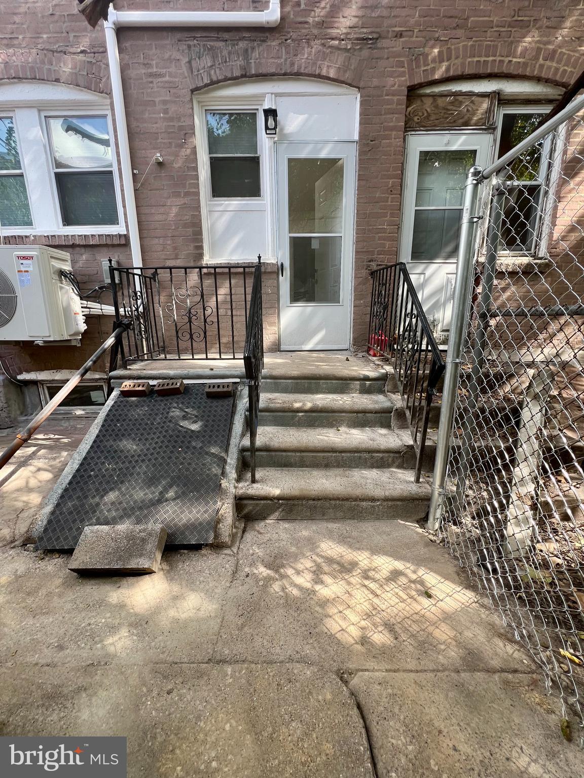 2610 Sylmar Street Philadelphia, PA 19142 - Photo 19 of 19 a view of building with car parked