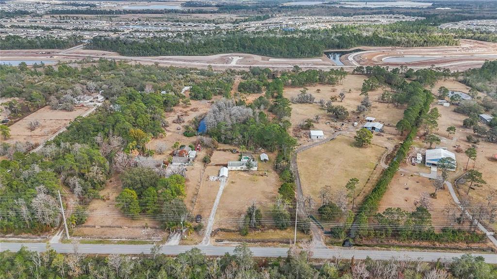 2665 Absher Road St. Cloud, FL 34771 - Photo 2 of 27 a view of a yard with large trees